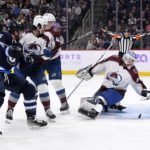 
              Colorado Avalanche's goaltender Alexandar Georgiev looks back at the puck as Winnipeg Jets' Blake Wheeler looks for the rebound during the second period of an NHL hockey game in Winnipeg, Manitoba, on Tuesday, Nov. 29, 2022. (Greenslade/The Canadian Press via AP)
            