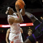 
              Maryland guard Ian Martinez (23) is fouled by Niagara guard Noah Thomasson (21) during the first half of an NCAA college basketball game, Monday, Nov. 7, 2022 in College Park, Md. (Katherine Frey/The Washington Post via AP)
            