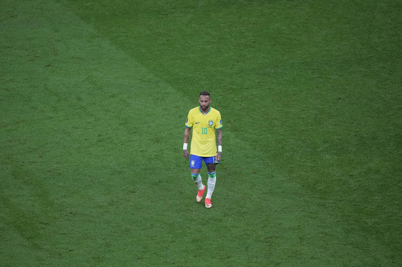 Brazil's Neymar walks on the pitch during the World Cup group G soccer match between Brazil and Ser...