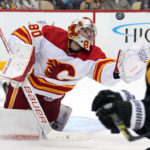 
              Calgary Flames goaltender Dan Vladar (80) reaches to glove the puck during the second period of the team's NHL hockey game against the Pittsburgh Penguins in Pittsburgh, Wednesday, Nov. 23, 2022. (AP Photo/Gene J. Puskar)
            