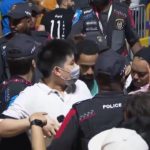 
              In this image from video, Qatari police try to control a crowd at a FIFA Fan Zone ahead of the World Cup in Doha, Qatar, Saturday, Nov. 19, 2022. Authorities turned away thousands of fans Saturday night from a concert celebrating the World Cup beginning the next day in Qatar, revealing the challenges ahead for Doha as it tries to manage crowds in FIFA's most-compact tournament ever. (AP Photo/Srdjan Nedeljkovic)
            