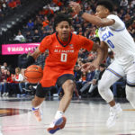 
              Illinois guard Terrence Shannon Jr. drives to the basket against UCLA guard Jaylen Clark during the first half of an NCAA college basketball game Friday, Nov. 18, 2022, in Las Vegas. (AP Photo/Chase Stevens)
            