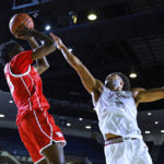 
              Houston guard Terrance Arceneaux shoots over Saint Joseph's guard Lynn Greer III during the first half of an NCAA college basketball game at the Veterans Classic, Friday, Nov. 11, 2022, in Annapolis, Md. (AP Photo/Terrance Williams)
            