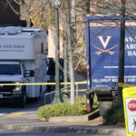 
              A Virginia State Police crime scene investigation truck is on the scene of an overnight shooting at the University of Virginia, Monday, Nov. 14, 2022, in Charlottesville. Va. (AP Photo/Steve Helber)
            
