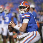 
              FILE -Florida quarterback Jalen Kitna (11) warms up before an NCAA college football game against Eastern Washington, Sunday, Oct. 2, 2022, in Gainesville, Fla. Florida backup quarterback Jalen Kitna, the son of retired NFL quarterback Jon Kitna, was arrested Wednesday, Nov. 30, 2022 and charged with two counts of distribution of child exploitation material and three counts of possession of child pornography. (AP Photo/Phelan M. Ebenhack, File)
            