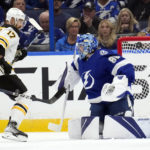 
              Boston Bruins left wing Nick Foligno (17) watches his shot get past Tampa Bay Lightning goaltender Andrei Vasilevskiy (88) for a goal during the second period of an NHL hockey game Monday, Nov. 21, 2022, in Tampa, Fla. (AP Photo/Chris O'Meara)
            