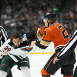 
              Minnesota Wild's Connor Dewar, left, fights with Anaheim Ducks' Nathan Beaulieu during the second period of an NHL hockey game Wednesday, Nov. 9, 2022, in Anaheim, Calif. (AP Photo/Jae C. Hong)
            