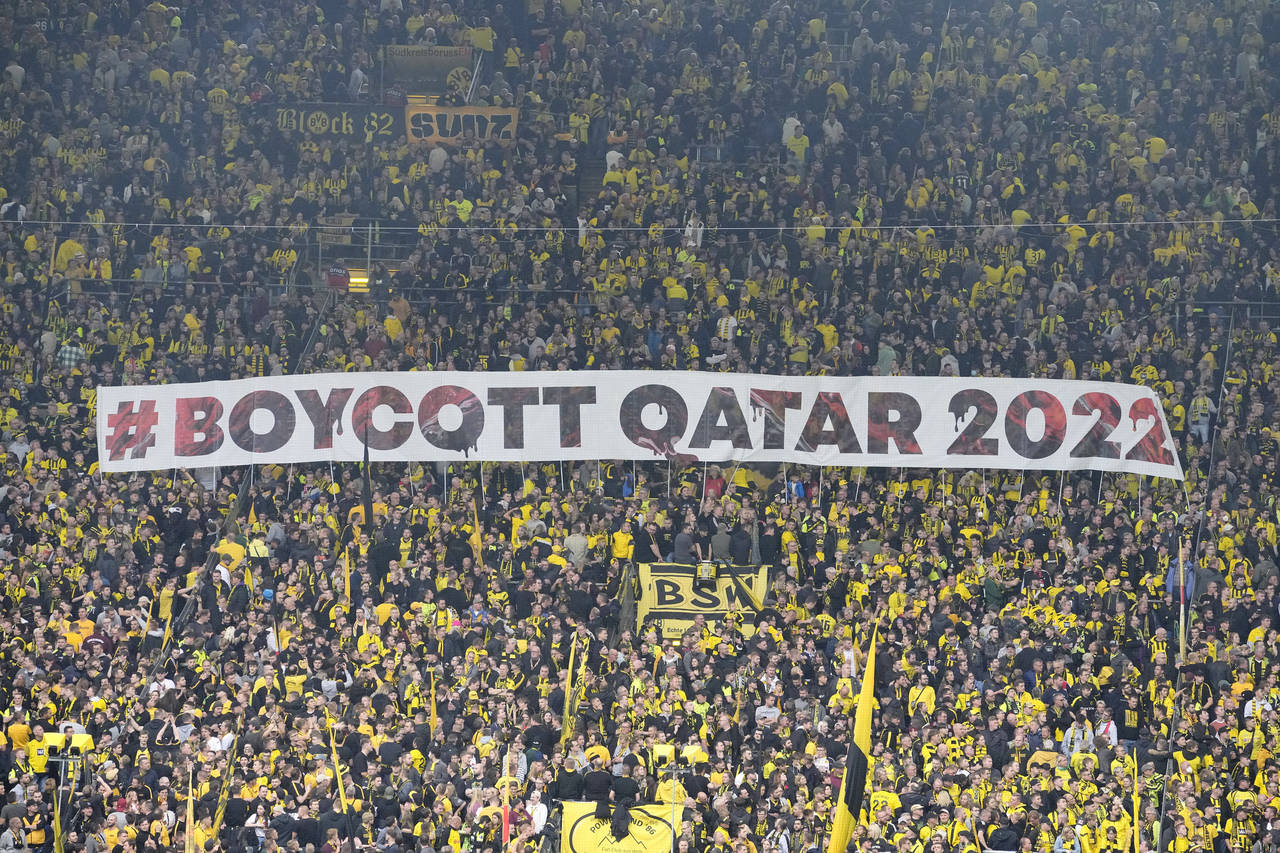 FILE -- Fans display a banner during the German Bundesliga soccer match between Borussia Dortmund a...