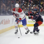 
              Montreal Canadiens' Juraj Slafkovsky, left, tries to control the puck as Columbus Blue Jackets' Jake Christiansen defends during the first period of an NHL hockey game Thursday, Nov. 17, 2022, in Columbus, Ohio. (AP Photo/Jay LaPrete)
            