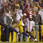 
              LSU quarterback Jayden Daniels (5) runs the ball past Alabama defensive back DeMarcco Hellams (2) to score a two-point conversion during overtime of an NCAA college football game in Baton Rouge, La., Saturday, Nov. 5, 2022. (AP Photo/Tyler Kaufman)
            