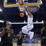 
              UCLA guard Amari Bailey dunks against Long Beach State during the first half of an NCAA college basketball game Friday, Nov. 11, 2022, in Los Angeles. (AP Photo/Marcio Jose Sanchez)
            