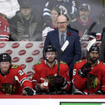
              Chicago Blackhawks head coach Luke Richardson, left, and assistant coaches Derek King and Derek Plante watch from the bench against the Winnipeg Jets during the third period of an NHL hockey game in Winnipeg, Manitoba, Saturday, Nov. 5, 2022. (Fred Greenslade/The Canadian Press via AP)
            