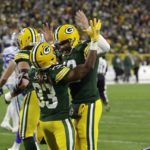 
              Aaron Jones (33) and Green Bay Packers quarterback Aaron Rodgers, center right, celebrate after Jones scored a touchdown during the first half of an NFL football game against the Dallas Cowboys Sunday, Nov. 13, 2022, in Green Bay, Wis. (AP Photo/Mike Roemer)
            