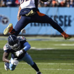 
              Denver Broncos tight end Eric Saubert (82) leaps over the tackle of Tennessee Titans cornerback Roger McCreary (21) during the second half of an NFL football game, Sunday, Nov. 13, 2022, in Nashville, Tenn. (AP Photo/Mark Zaleski)
            