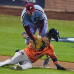 
              Philadelphia Phillies first baseman Rhys Hoskins tags Houston Astros' Yuli Gurriel in a run down during the seventh inning in Game 5 of baseball's World Series between the Houston Astros and the Philadelphia Phillies on Thursday, Nov. 3, 2022, in Philadelphia. (AP Photo/Matt Rourke)
            