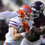 
              Florida wide receiver Ricky Pearsall (1) is tackled for no gain on a play by Texas A&M linebacker Edgerrin Cooper (45) during the second quarter of an NCAA college football game Saturday, Nov. 5, 2022, in College Station, Texas. (AP Photo/Sam Craft)
            