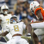 
              Miami safety Kamren Kinchens, right, breaks up pass intended for Georgia Tech wide receiver Nate McCollum (8) in the first half of an NCAA college football game Saturday, Nov. 12, 2022, in Atlanta. (AP Photo/Hakim Wright Sr.)
            