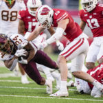 
              Wisconsin safety John Torchio (15) tackles Minnesota running back Mohamed Ibrahim (24) during the first half of an NCAA college football game Saturday, Nov. 26, 2022, in Madison, Wis. (AP Photo/Andy Manis)
            