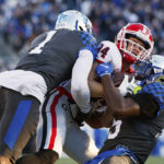
              Kentucky defensive back Keidron Smith (1) and linebacker Jordan Wright, right, bring down Georgia wide receiver Ladd McConkey (84) during the first half of an NCAA college football game in Lexington, Ky., Saturday, Nov. 19, 2022. (AP Photo/Michael Clubb)
            