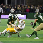 
              Colorado State defensive back Henry Blackburn (11) makes an interception on a pass intended for Wyoming tight end John Michael Gyllenborg (84) during the first quarter of an NCAA college football game Saturday, Nov. 12, 2022, in Fort Collins, Colo. (Andy Cross/The Denver Post via AP)
            