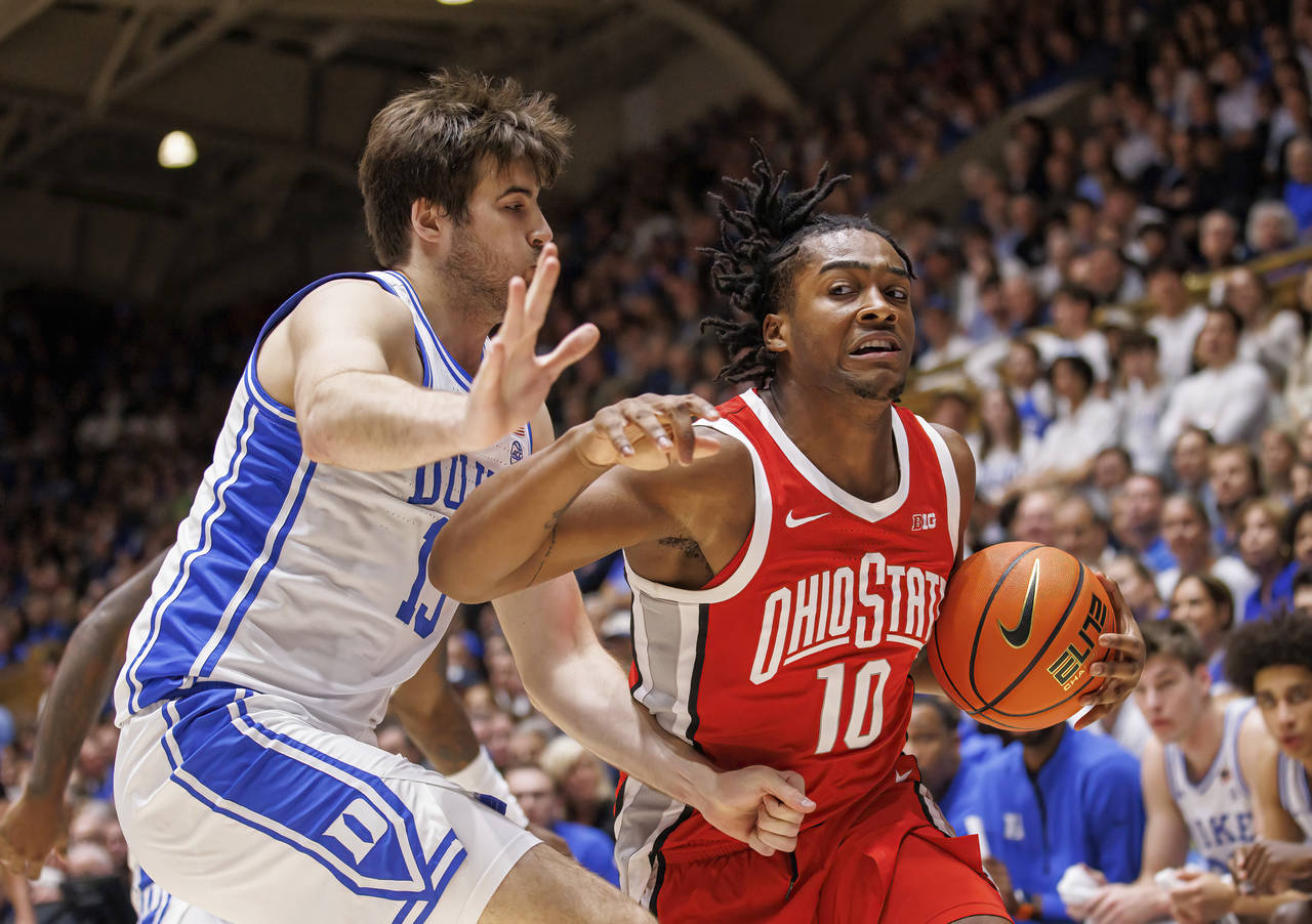 Ohio State's Brice Sensabaugh (10) drives against Duke's Ryan Young (15) during the first half of a...