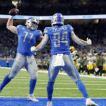 
              Detroit Lions center Frank Ragnow (77) spikes the ball after tight end Shane Zylstra's 1-yard reception for a touchdown during the first half of an NFL football game against the Green Bay Packers, Sunday, Nov. 6, 2022, in Detroit. (AP Photo/Duane Burleson)
            