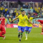 
              Brazil's Casemiro, center, celebrates after scoring his side's opening goal during the World Cup group G soccer match between Brazil and Switzerland, at the Stadium 974 in Doha, Qatar, Monday, Nov. 28, 2022. (AP Photo/Andre Penner)
            