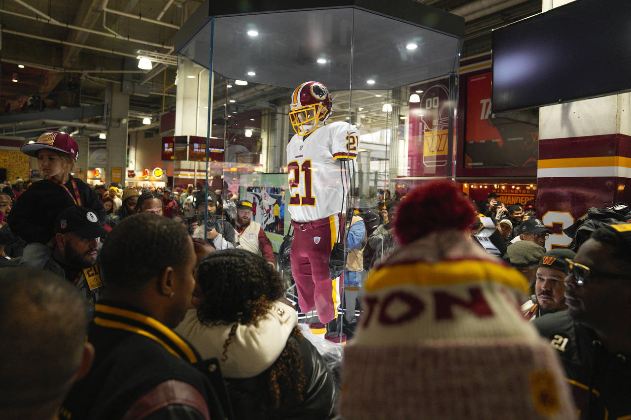 Fans attends the unveiling of the Sean Taylor Memorial, before the start of an NFL football game be...