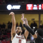 
              Texas Tech's forward Kevin Obanor (0) shoots a three-pointer against Georgetown during an NCAA college basketball game, Wednesday, Nov. 30, 2022, at United Supermarkets Arena in Lubbock, Texas. (Annie Rice/Lubbock Avalanche-Journal via AP)
            