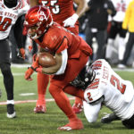 
              North Carolina State linebacker Jaylon Scott (2) tries to bring down Louisville running back Maurice Turner during the second half of an NCAA college football game in Louisville, Ky., Saturday, Nov. 19, 2022. (AP Photo/Timothy D. Easley)
            