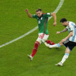 
              Argentina's Lionel Messi scores his side's first goal during the World Cup group C soccer match between Argentina and Mexico, at the Lusail Stadium in Lusail, Qatar, Saturday, Nov. 26, 2022. (AP Photo/Julio Cortez)
            