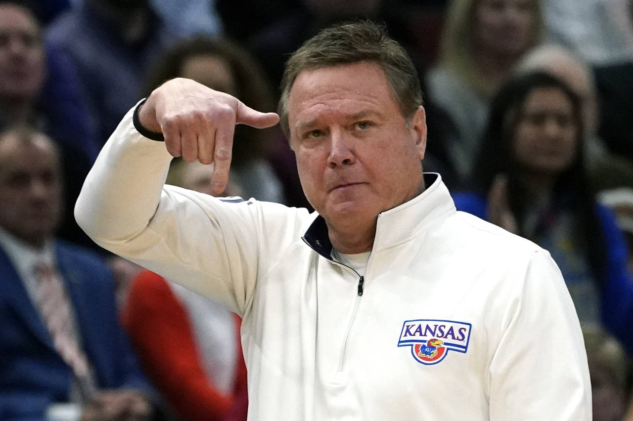 FILE - Kansas head coach Bill Self reacts during the second half of a college basketball game again...