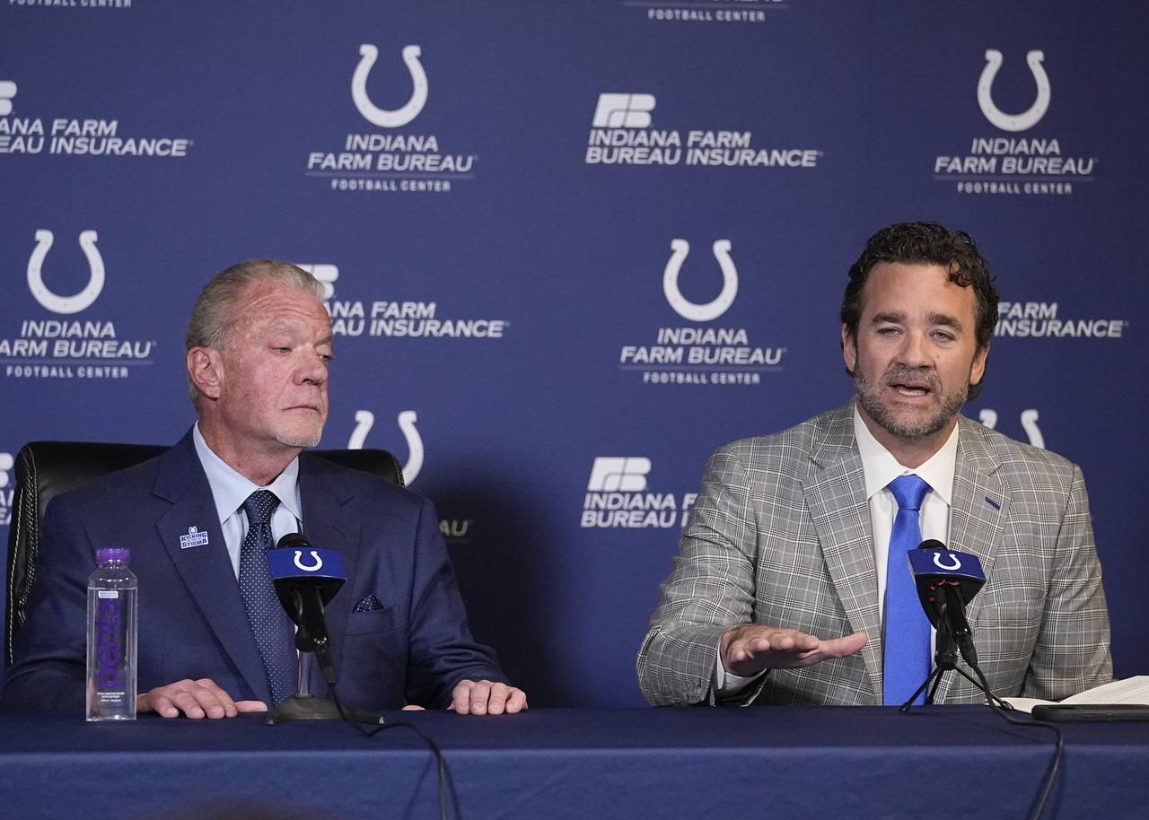 Indianapolis Colts interim coach Jeff Saturday speaks as owner Jim Irsay listens during a news conf...