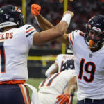 
              Chicago Bears quarterback Justin Fields (1) celebrates his touchdown with Chicago Bears wide receiver Equanimeous St. Brown (19) during the first half of an NFL football game against the Atlanta Falcons, Sunday, Nov. 20, 2022, in Atlanta. (AP Photo/Brynn Anderson)
            