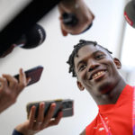 
              Switzerland's forward Breel Embolo speaks to journalists during after a closed training session of Swiss national soccer team in preparation for the World Cup Qatar 2022 at the University of Doha for Science and Technology training facilities, in Doha, Qatar, Tuesday, Nov. 22, 2022. The Swiss national soccer team will play in group G of the World Cup Qatar 2022. (Laurent Gillieron/Keystone via AP)
            