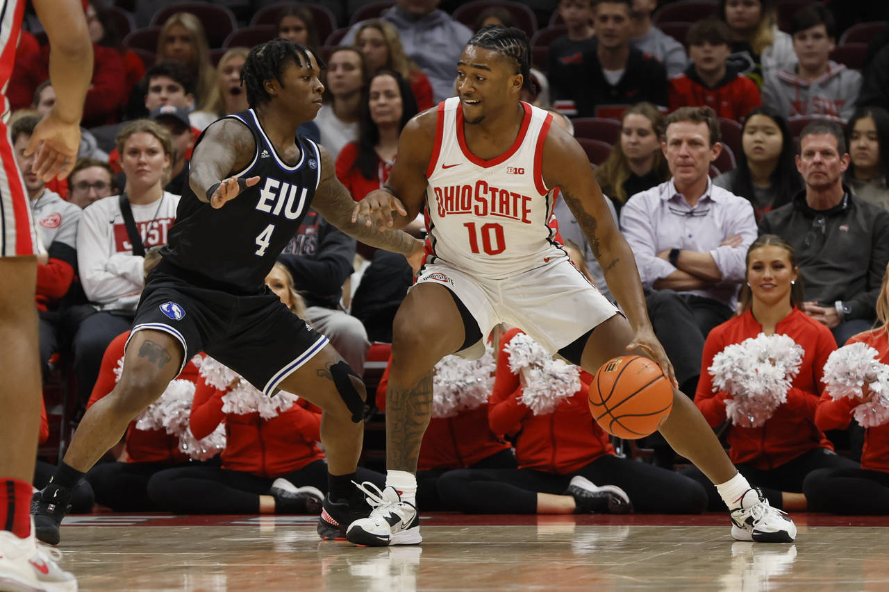 Ohio State's Brice Sensabaugh, right, posts up against Eastern Illinois' Yaakema Rose during the fi...