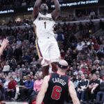 
              New Orleans Pelicans forward Zion Williamson (1) goes up for a shot against Chicago Bulls guard Alex Caruso during the second half of an NBA basketball game Wednesday, Nov. 9, 2022, in Chicago. The Pelicans won 115-111.(AP Photo/Nam Y. Huh)
            