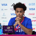 
              Tyler Adams of the United States attends a press conference on the eve of the group B World Cup soccer match between Iran and the United States in Doha, Qatar, Monday, Nov. 28, 2022. (AP Photo/Ashley Landis)
            