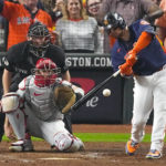 
              Houston Astros' Christian Vazquez hits an RBI single during the sixth inning in Game 6 of baseball's World Series between the Houston Astros and the Philadelphia Phillies on Saturday, Nov. 5, 2022, in Houston. (AP Photo/Sue Ogrocki)
            