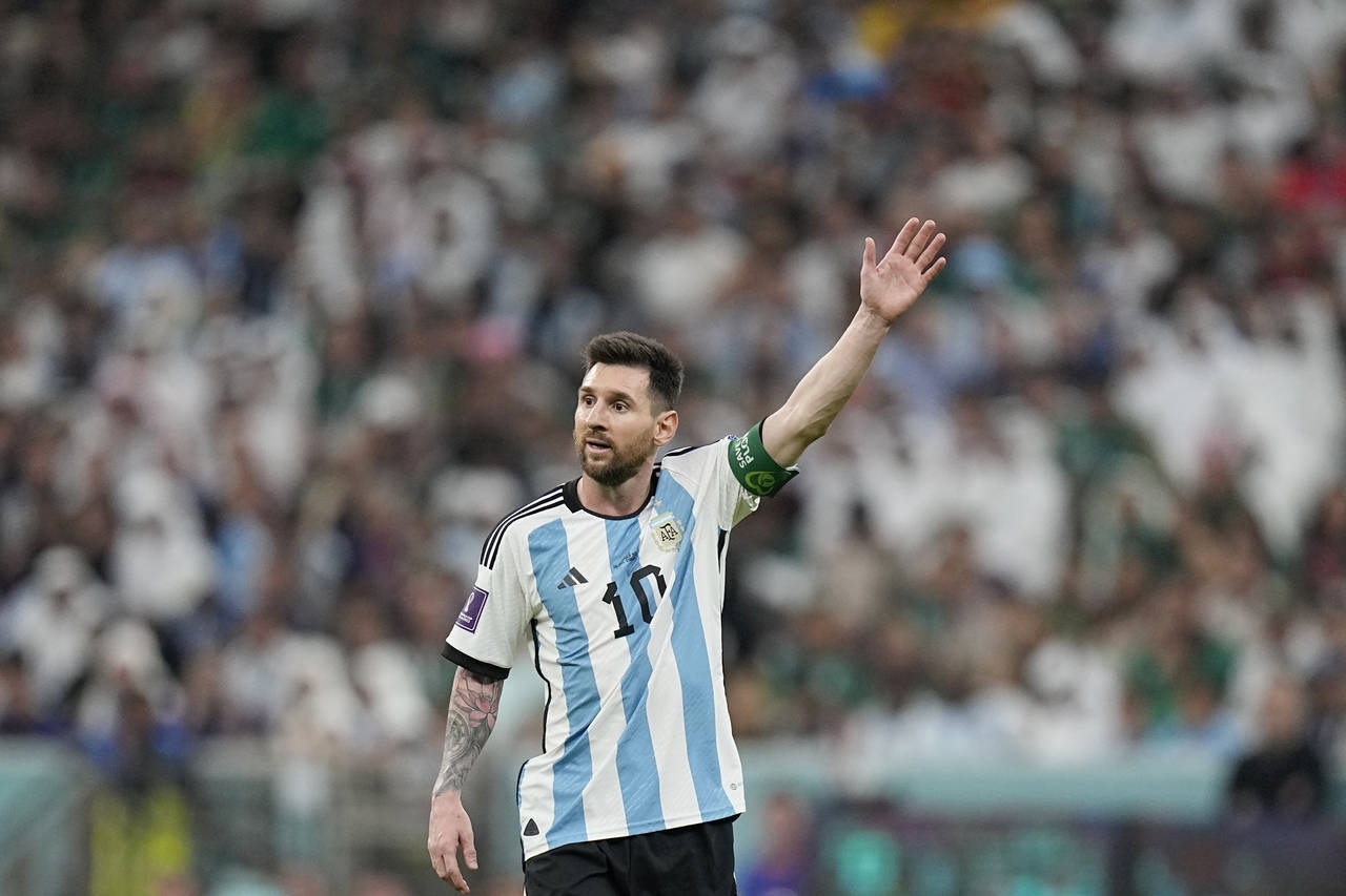 Argentina's Lionel Messi gestures during the World Cup group C soccer match between Argentina and M...