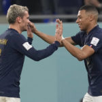 
              France's Kylian Mbappe, right, celebrates with France's Antoine Griezmann after scoring his sides first goal during the World Cup group D soccer match between France and Denmark, at the Stadium 974 in Doha, Qatar, Saturday, Nov. 26, 2022. (AP Photo/Thanassis Stavrakis)
            