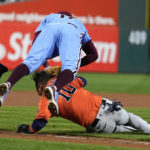 
              Philadelphia Phillies first baseman Rhys Hoskins tags Houston Astros' Yuli Gurriel in a run down during the seventh inning in Game 5 of baseball's World Series between the Houston Astros and the Philadelphia Phillies on Thursday, Nov. 3, 2022, in Philadelphia. (AP Photo/Matt Slocum)
            