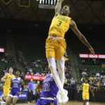 
              Baylor guard Dale Bonner (3) scores over McNeese State forward Dionjahe Thomas (12) during the second half of an NCAA college basketball game Wednesday, Nov. 23, 2022, in Waco, Texas. (AP Photo/Rod Aydelotte)
            