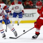
              Montreal Canadiens right wing Brendan Gallagher (11) passes the puck against Detroit Red Wings defenseman Filip Hronek (17) during the second period of an NHL hockey game Tuesday, Nov. 8, 2022, in Detroit. (AP Photo/Duane Burleson)
            