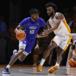 
              Florida Gulf Coast forward Zach Anderson (10) drives against Tennessee guard Josiah-Jordan James during the first half of an NCAA college basketball game Wednesday, Nov. 16, 2022, in Knoxville, Tenn. (AP Photo/Wade Payne)
            