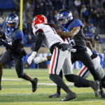 
              Kentucky wide receiver Barion Brown (2) runs the ball down the field while being chased by Georgia defensive back Kelee Ringo (5) during the second half of an NCAA college football game in Lexington, Ky., Saturday, Nov. 19, 2022. (AP Photo/Michael Clubb)
            