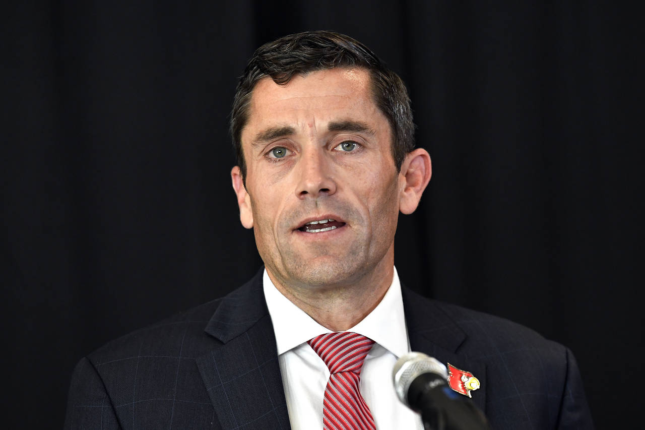 University of Louisville Athletic Director Josh Heard speaks with reporters during a press conferen...