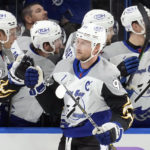 
              Tampa Bay Lightning center Steven Stamkos (91) celebrates with the bench after scoring against the Calgary Flames during the first period of an NHL hockey game Thursday, Nov. 17, 2022, in Tampa, Fla. (AP Photo/Chris O'Meara)
            