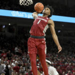 
              Arkansas guard Ricky Council IV (1) goes up to dunk on a fast break against Fordham during the second half of an NCAA college basketball game Friday, Nov. 11, 2022, in Fayetteville, Ark. (AP Photo/Michael Woods)
            