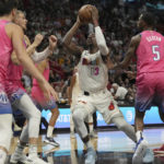 
              Miami Heat center Bam Adebayo (13) goes up for a shot against the Washington Wizards during the first half of an NBA basketball game, Wednesday, Nov. 23, 2022, in Miami. (AP Photo/Jim Rassol)
            